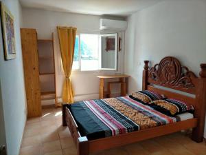 Postel nebo postele na pokoji v ubytování Bel appartement avec piscine, face à la mer