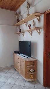 A television and/or entertainment centre at Island house in Elika - Marathias