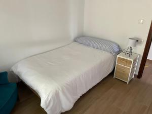 A bed or beds in a room at Villa May en Riegu Vidiago Llanes