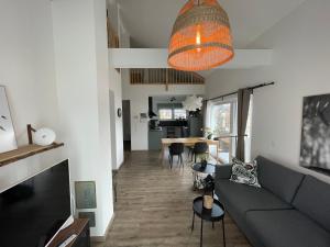 a living room with a couch and a table at Mein Chalet in Leutasch +38 photos