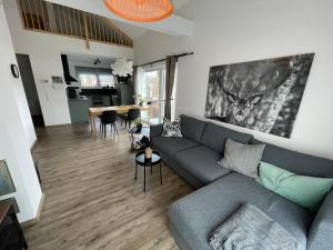 a living room with a couch and a table at Mein Chalet in Leutasch
