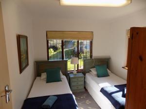 Postel nebo postele na pokoji v ubytování Protea Guest House