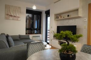 a living room with a couch and a table at Dunja's home in Zlatibor
