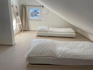 Ένα ή περισσότερα κρεβάτια σε δωμάτιο στο Mein Chalet