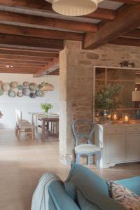 a living room with a couch and a table at Terranam Bed & Breakfast in Catoira +20 photos
