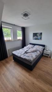 Postel nebo postele na pokoji v ubytování Ferienwohnung bei Natie