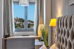 Ein Sitzbereich in der Unterkunft Acropolis City Life BH