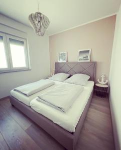 Postel nebo postele na pokoji v ubytování Apartment Mala Medulin + 10 fotografií