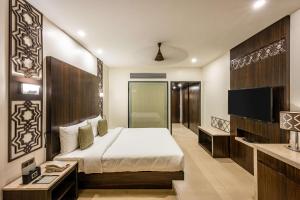 Silver Waves Resort & Spa - Daman客房内的一张或多张床位