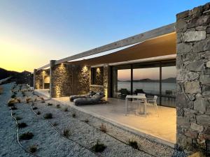 a house with a view of the ocean at Echoes Milos in Kástron
