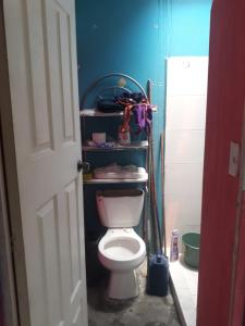 a bathroom with a white toilet in a room at Diablillo in Monterrey +25 photos