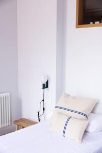 Łóżko lub łóżka w pokoju w obiekcie Apartamento ático en el casco antiguo