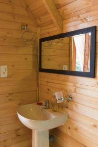 a bathroom with a sink and a mirror at Glamping las 4 estaciones in Guatavita +45 photos