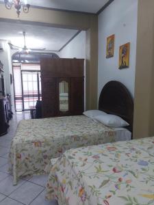 Postelja oz. postelje v sobi nastanitve Casa Huatulco