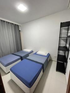 Postel nebo postele na pokoji v ubytování Flats do Lucca 01 Tamandaré