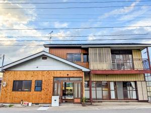 a large building with at Guest House Inawashiro~Hanbog~ in Inawashiro