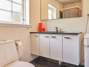 a bathroom with a sink and a toilet at Holiday home Aakirkeby XXXIV in Vester Sømarken
