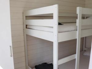 a couple of bunk beds in a room at Holiday home SÄFFLE IV in Säffle