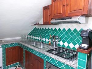 Kuchyň nebo kuchyňský kout v ubytování La Casa di Nonna Romina + 2 fotografie