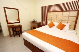 Cama o camas de una habitación en Jatra Grand Castle Hotel