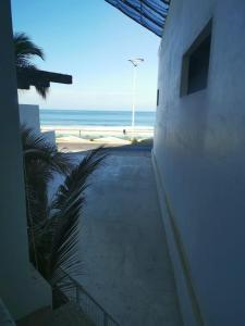 a view of the beach from a balcony of a building at TORRE MAR Frente al Malecón in Mazatlán