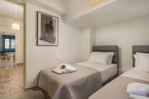 Postel nebo postele na pokoji v ubytování Crescendo City House