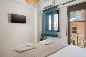Postel nebo postele na pokoji v ubytování Crescendo City House