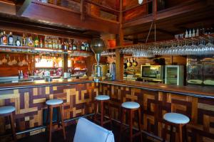a bar with bar stools in a restaurant at Grand Fortim Maceio Praia in Camocim +24 photos