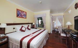 En eller flere senge i et værelse på Saigon Phu Quoc Resort & Spa