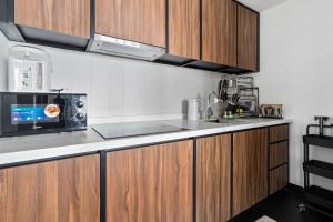 Η κουζίνα ή μικρή κουζίνα στο Una serviced Apartment