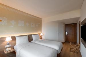 ibis Mumbai Airport - An Accor Brand客房内的一张或多张床位