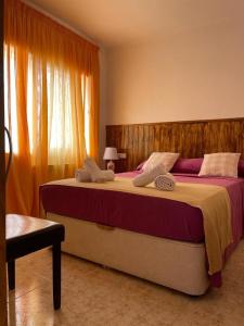 Posteľ alebo postele v izbe v ubytovaní Rooms Pineda