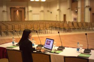 a woman sitting at a table with a laptop at Rixos-Prykarpattya Resort in Truskavets +37 photos