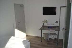 TV a/nebo společenská místnost v ubytování Boutique-Hotel "Stilvoll"