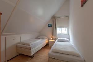 Postel nebo postele na pokoji v ubytování Buitenplaats 16 Callantsoog