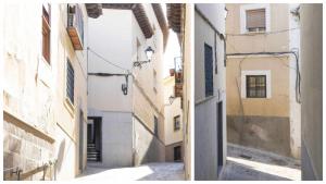 an empty alley in an alley between two buildings at La Casa de San Miguel by Toledo AP in Toledo