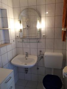 a white bathroom with a sink and a mirror at La Villa - Beach house & Rooms in Crikvenica +86 photos