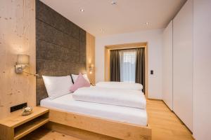 Katil atau katil-katil dalam bilik di Chalets Dolomit Royal