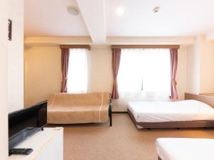 TV a/nebo společenská místnost v ubytování Tabist Business Hotel R Side Kanazawa