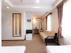 Postel nebo postele na pokoji v ubytování Tabist Business Hotel R Side Kanazawa
