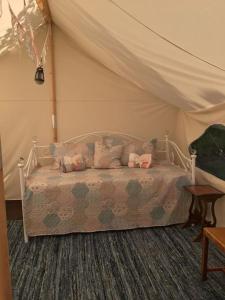 a bedroom with a bed in a tent at Amelia Vera in Lincolnshire