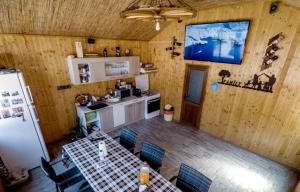 an overhead view of a kitchen with a table and chairs at Cazare Sulinaa in Sulina
