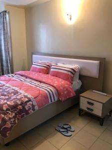 Postel nebo postele na pokoji v ubytování Maliaways Comfy Airbnb-Jkia