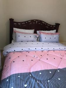 Postel nebo postele na pokoji v ubytování Maliaways Comfy Airbnb-Jkia