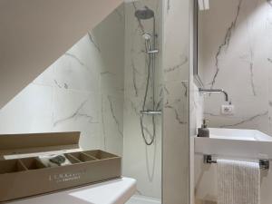 a bathroom with a shower and a sink at Bardolino Luxury in Bardolino +49 photos