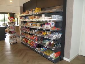 a store aisle with a display of food and drinks at EuroParcs Ruinen in Ruinen