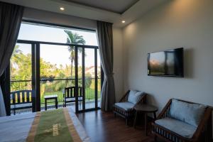 TV a/nebo společenská místnost v ubytování Coco Island Villa