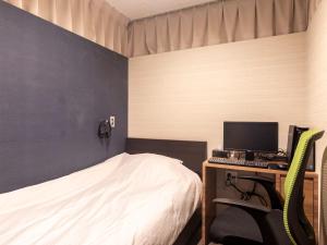 TV a/nebo společenská místnost v ubytování Tabist Hotel Smart Sleeps Oita Station
