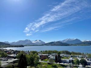 a view of a city and a lake and mountains at A11 in Ålesund