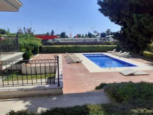 a swimming pool with lounge chairs around it at Rumi place in Varna City